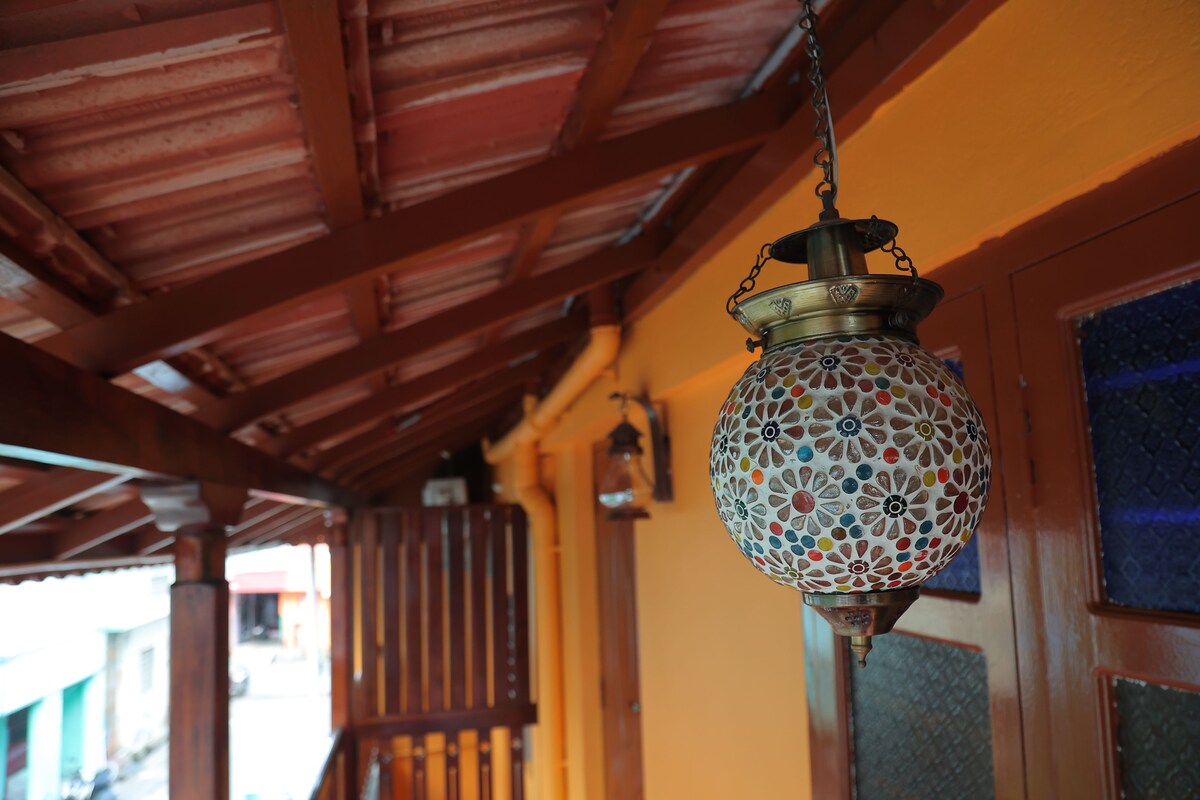 A hanging lantern with a floral pattern.