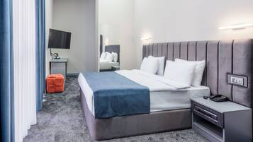 Family Suite, 2 Bedrooms, Balcony, City View | In-room safe, soundproofing, iron/ironing board, free WiFi