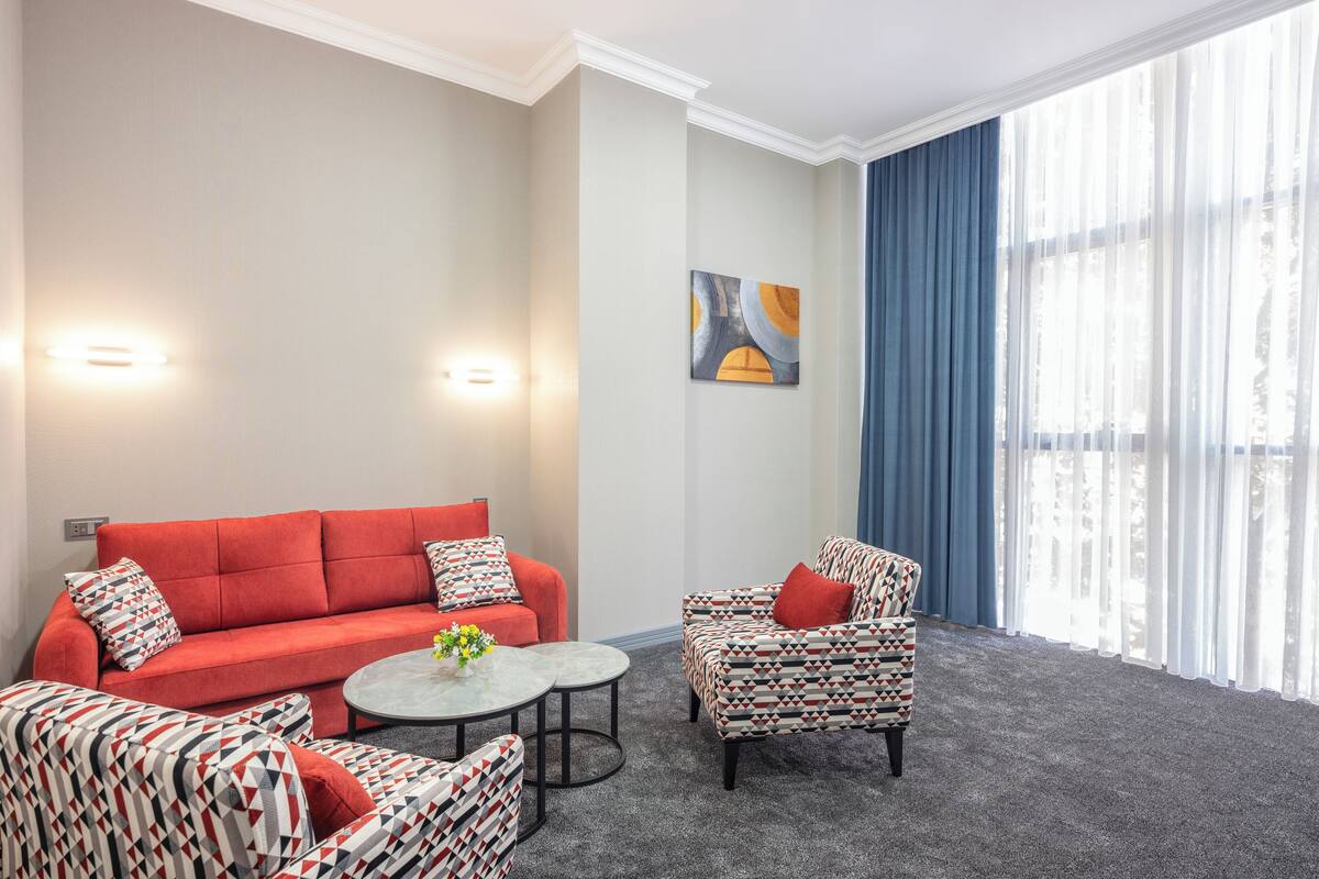Family Suite, 2 Bedrooms, Balcony, City View | Living area | Printers