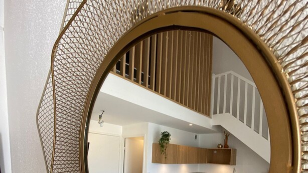 A modern kitchen with a built-in washing machine, a sink, and a stove. - Waterfront apartment (sea view) (Concarneau)