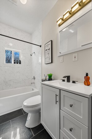 Shower, eco-friendly toiletries, towels, soap