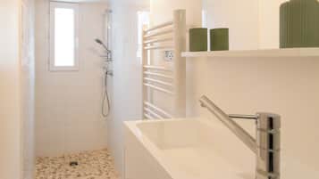 Shower, hair dryer, towels, toilet paper