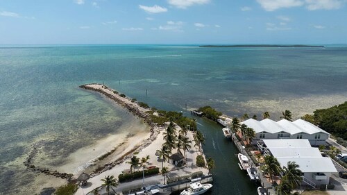 Resort-style condo short walk from the ocean, includes golf cart.