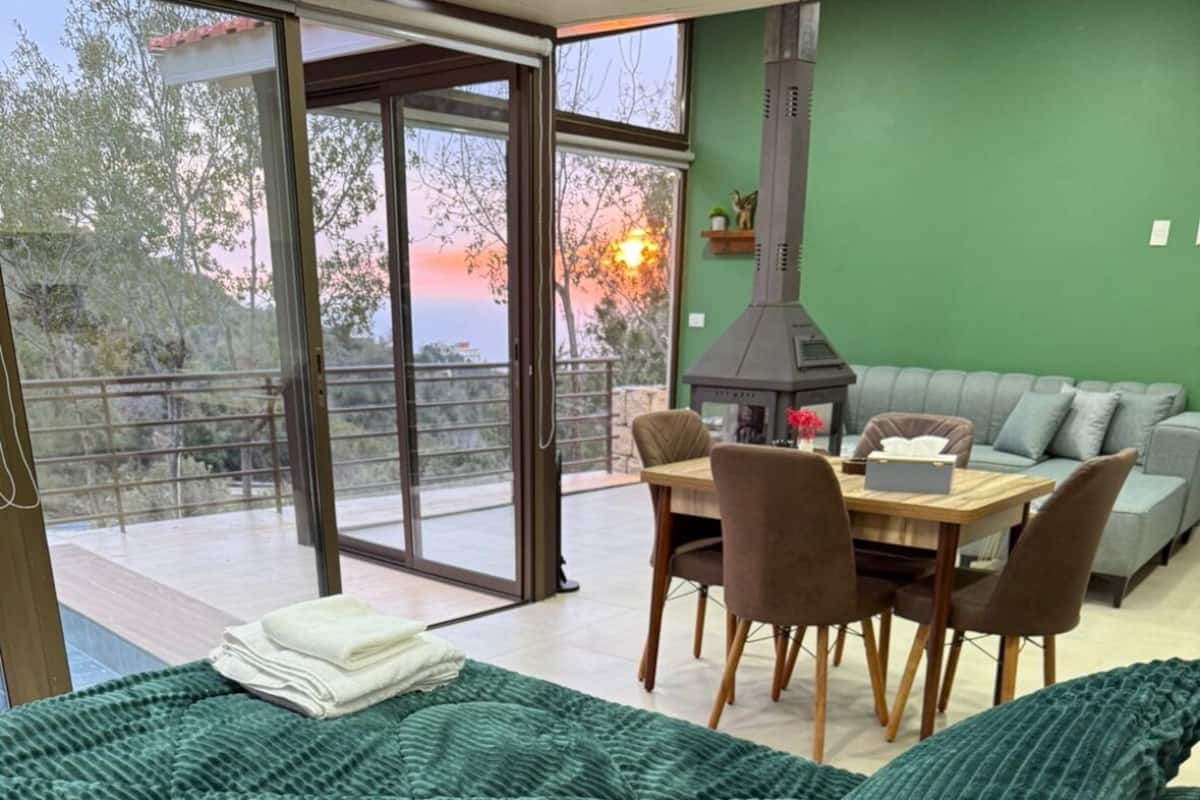 Luxury Chalet, 1 King Bed, Garden View | Living area | Fireplace