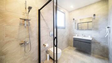 Shower, hair dryer, towels, shampoo