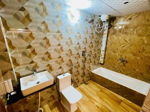 Separate bathtub and shower, slippers, towels, soap - Sri Madhubani Enclave (Prayagraj)