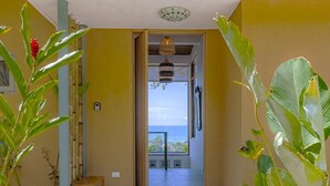 A hallway leading to a balcony with a view of the ocean. - Villa Perla De Mar - Prime Ocean views and walking distance to beach! (Provincia de Puntarenas)