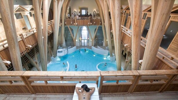 A spa area with a pool, wooden deck, and a massage chair. - Charming 4-bedroom townhome in Rabastens-de-Bigorre at the base of the Pyrenees. (Rabastens-de-Bigorre)