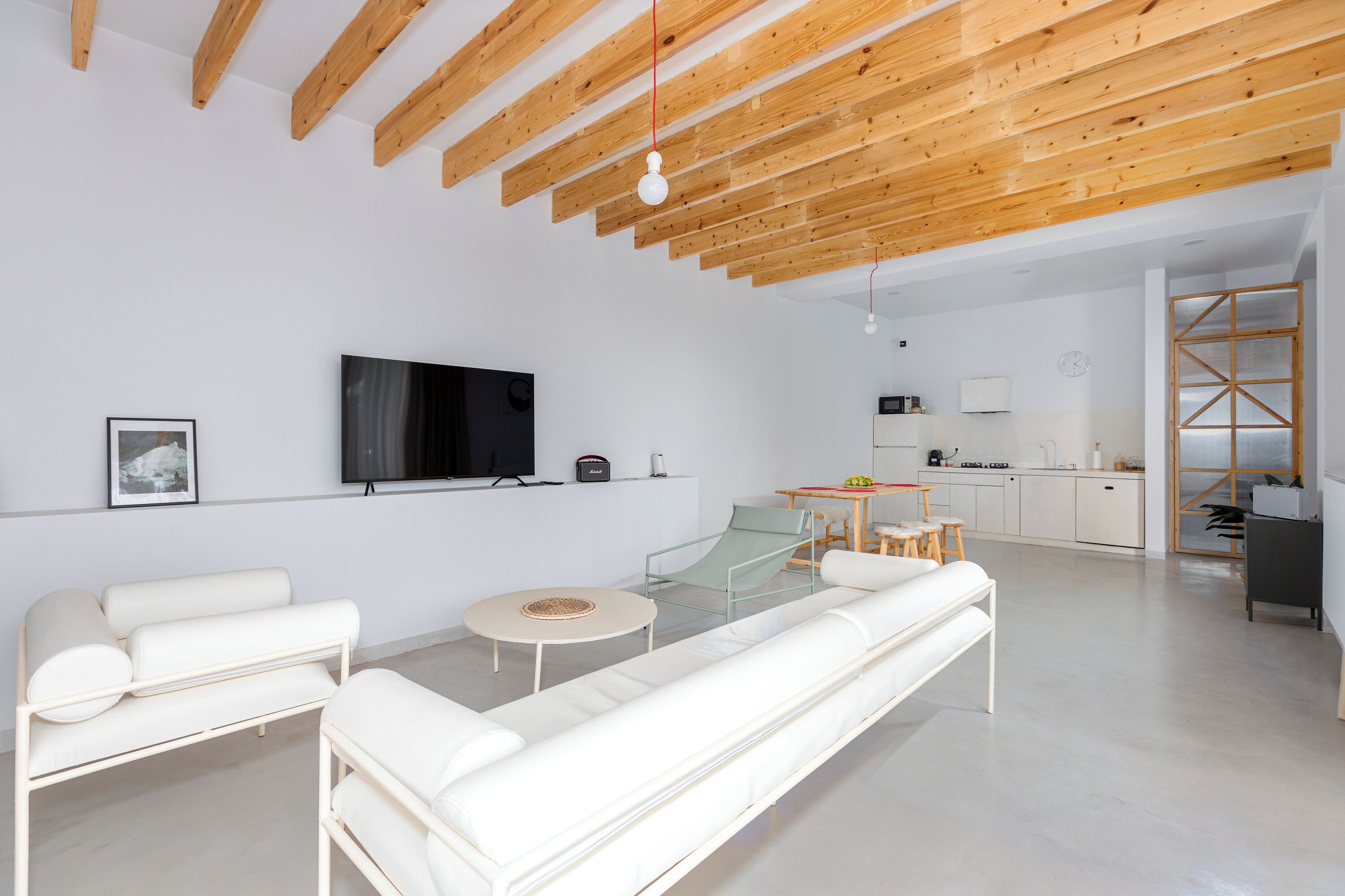 Smart TV, fireplace, books, computer monitors