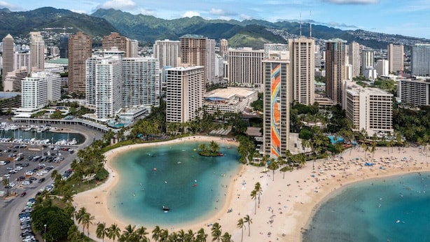 A coastal cityscape with high-rise buildings, a beach, and a marina. - 16 FREE Parking/Ocean 1b Waikiki (Honolulu)