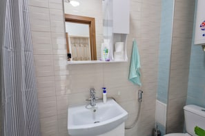 Shower, towels, soap, toilet paper