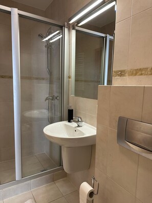 Shower, towels, soap, toilet paper