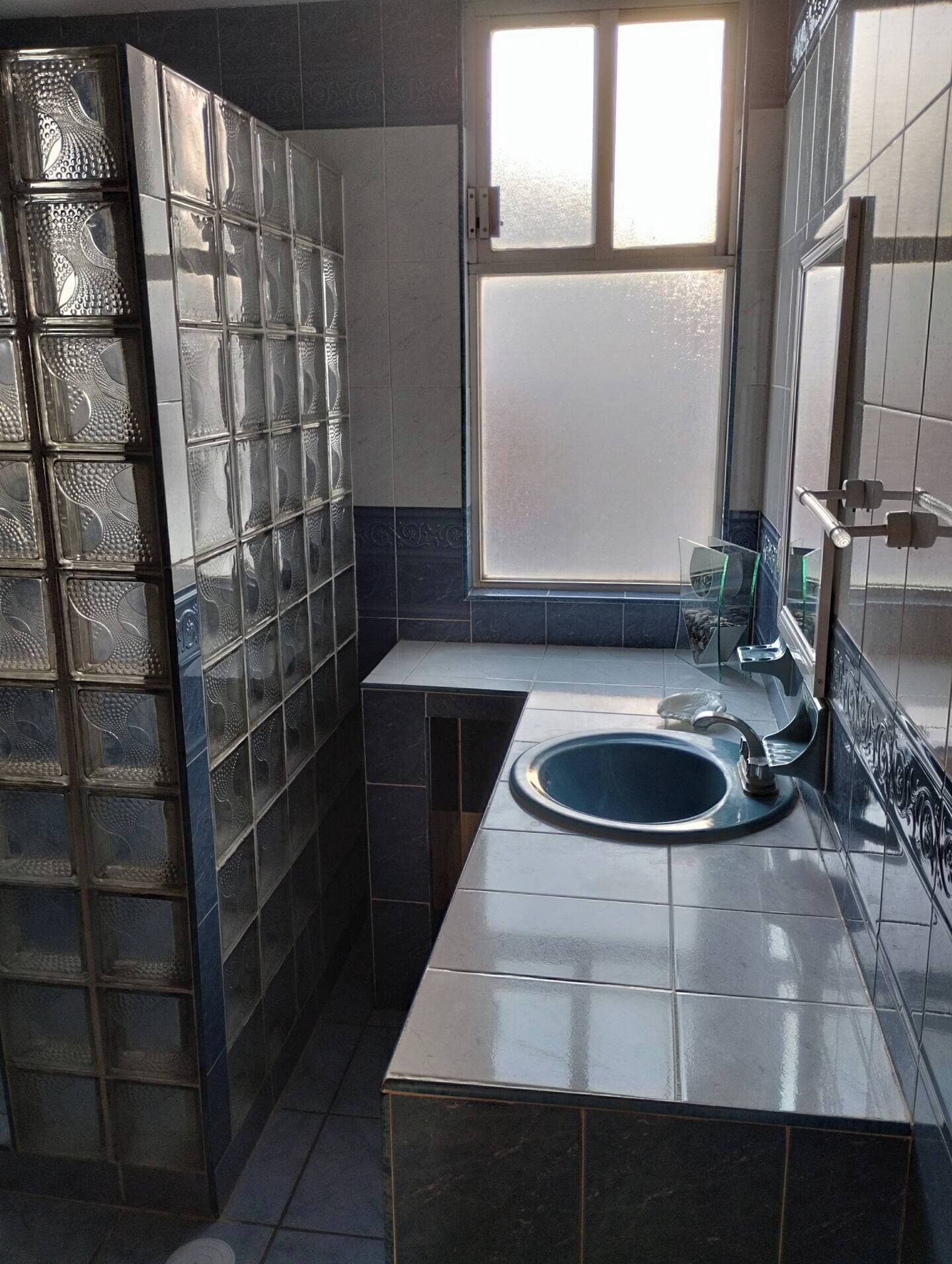 Shower, towels, soap, toilet paper