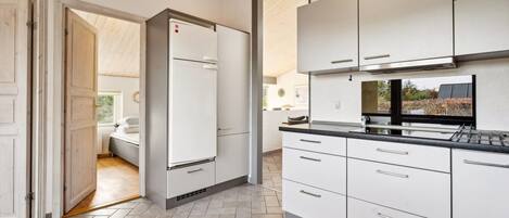 Fridge, stovetop, dishwasher, coffee/tea maker