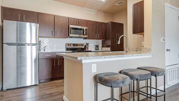 Apartment, 1 Bedroom | Private kitchen | Full-sized fridge, microwave, stovetop, dishwasher