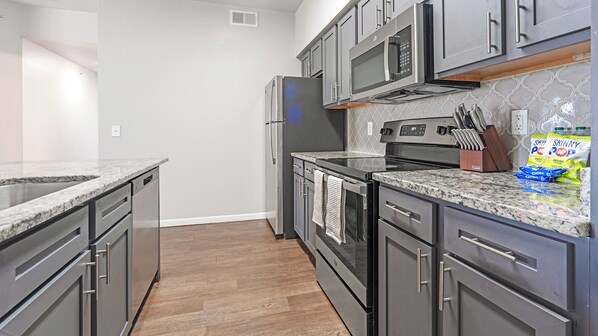 Apartment, 2 Bedrooms | Private kitchen | Full-size fridge, microwave, stovetop, dishwasher