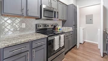 Apartment, 2 Bedrooms | Private kitchen | Full-sized fridge, microwave, stovetop, dishwasher