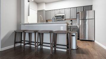 Apartment, 2 Bedrooms | Private kitchen | Full-size fridge, microwave, stovetop, dishwasher