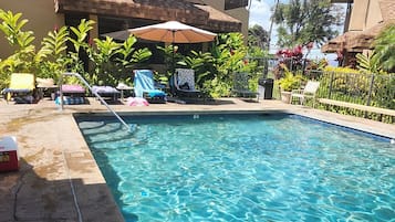 Outdoor pool, open 9:00 AM to 10:00 PM, pool umbrellas, sun loungers