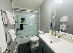 Shower, hair dryer, towels, soap