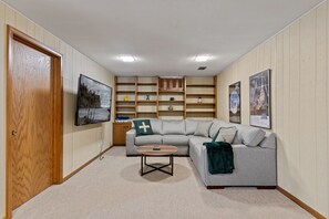House (3 Bedrooms) | Living room | TV, foosball, books