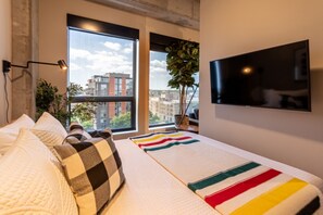 Apartment (0 Bedroom) | Laptop workspace, bed sheets