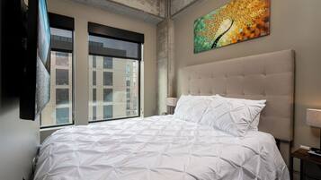 Apartment (0 Bedroom) | Laptop workspace, bed sheets