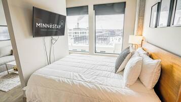 Apartment (0 Bedroom) | Laptop workspace, bed sheets