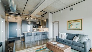 A modern apartment with a kitchen, dining area, and living room. - Sable 805 - Two Bedroom (Minneapolis)