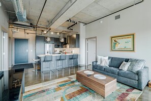 A modern apartment with a kitchen, dining area, and living room. - Sable 805 - Two Bedroom (Minneapolis)
