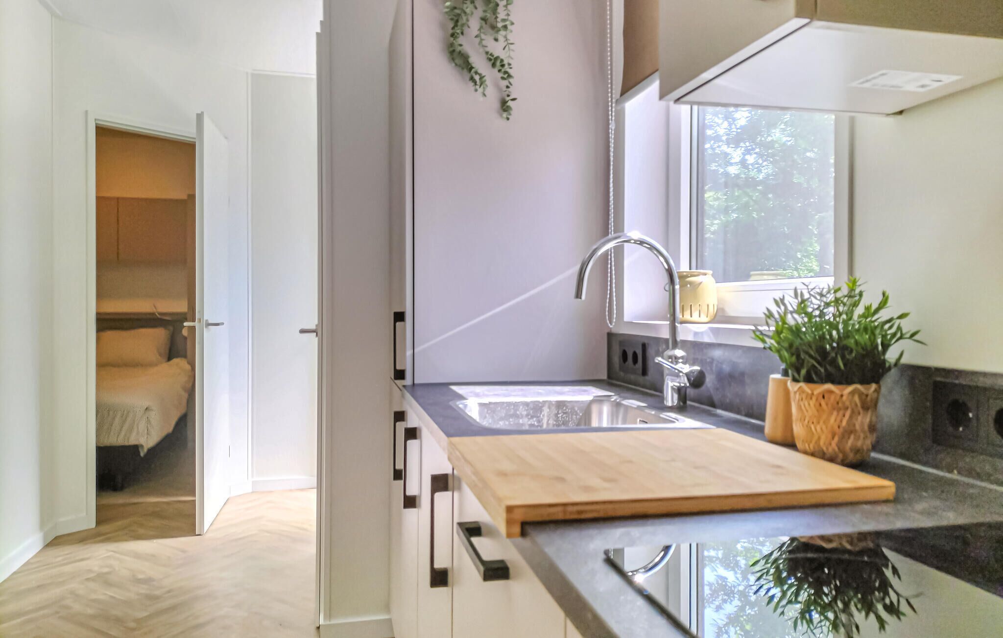 Fridge, stovetop, dishwasher, coffee/tea maker