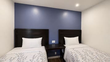 Economy Quadruple Room, 2 Double Beds, Non Smoking | Desk, laptop workspace, free WiFi, bed sheets