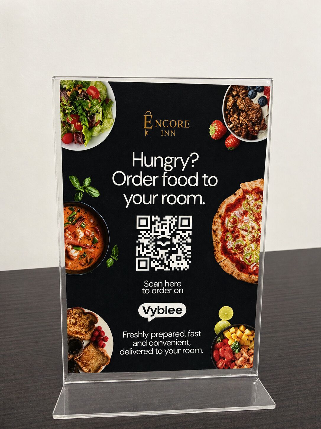 A promotional display for Encore Inn's room service with a QR code for ordering food.