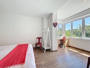 Desk, iron/ironing board, bed sheets