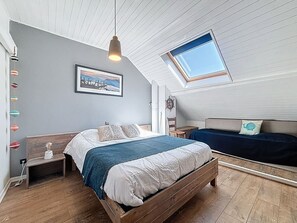Desk, iron/ironing board, bed sheets