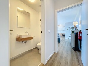 Shower, hair dryer, towels, toilet paper