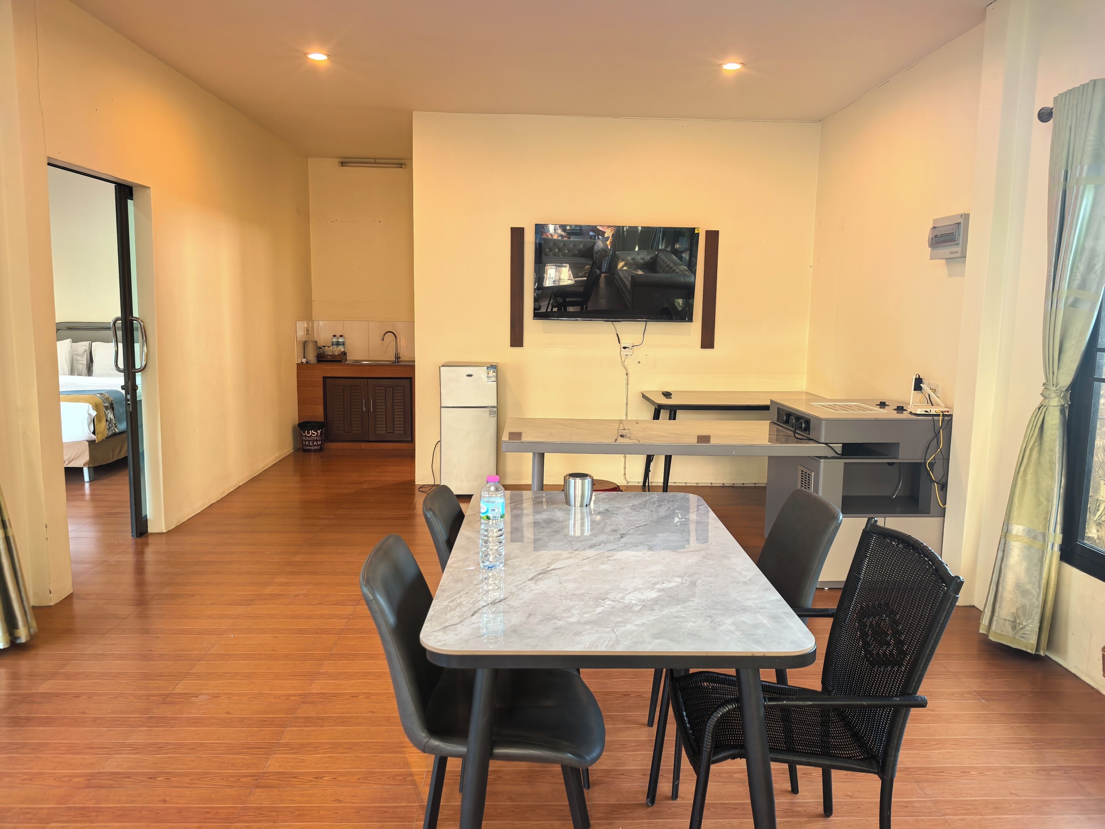 A modern kitchen with a dining area.
