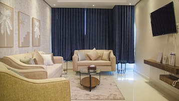 Familienapartment | Wohnbereich | Flachbildfernseher