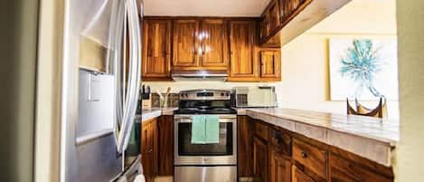 Departamento Confort, varias camas, aire acondicionado, vista a la ciudad | Cocina privada