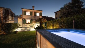 A two-story house with a swimming pool, stone walls, and green shutters. - Casa I Tre Cipressi with Swimming Pool (Capannori)