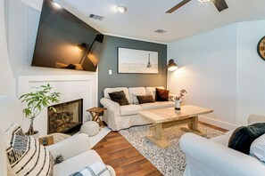 TV, fireplace, books