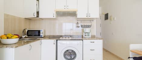 Fridge, microwave, stovetop, coffee/tea maker