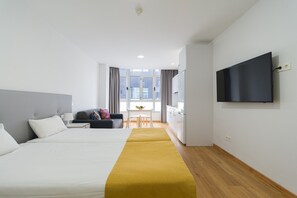 Desk, iron/ironing board, travel cot