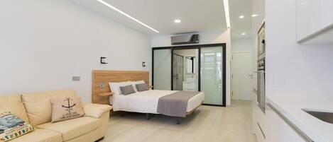 Desk, iron/ironing board, travel cot