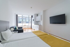 Desk, iron/ironing board, travel cot