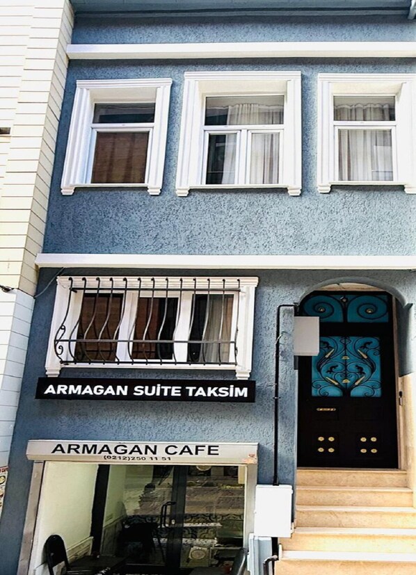 A building with a sign for 'ARMAGAN SUITE TAKSIM' and 'ARMAGAN CAFE'. - Armagan Suite Taksim (Istanbul)