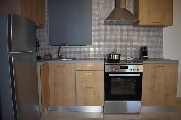 Comfort Apartment, City View | Private kitchen | Full-size fridge, oven, stovetop, espresso maker