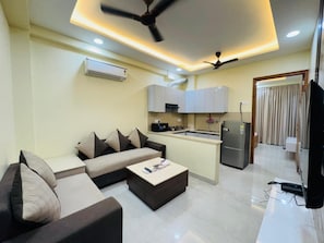 42-inch Smart TV with digital channels, fireplace, heated floors - Akshay Premium Suites (Gurugram)