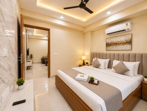 Premium bedding, down comforters, pillowtop beds, desk - Akshay Premium Suites (Gurugram)