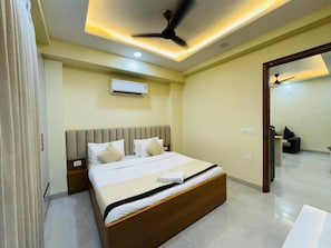 Premium bedding, down comforters, pillowtop beds, desk - Akshay Premium Suites (Gurugram)